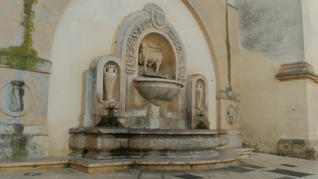 Bull fountain in Piazza Salandra in Nard&ograve;, in the south of Italy.