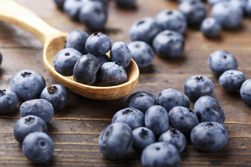 ripe organic bog whortleberry in a wooden plate