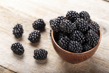 Blackberry on a wooden background. space for text. top view