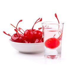 Cherry in syrup in a white bowl isolated on a white background