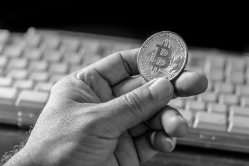 Glass globe and Bitcoin Cryptocurrency on keyboard. Business concept
