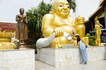 Thai women people visit and respect praying Katyayana or Gautama Buddha at Wat Sakae Krang