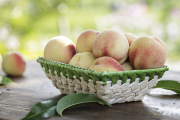 ripe peaches in a fruit basket