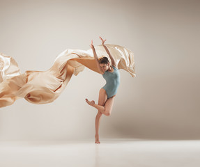 Modern ballet dancer dancing in full body on white studio background. - obrazy, fototapety, plakaty