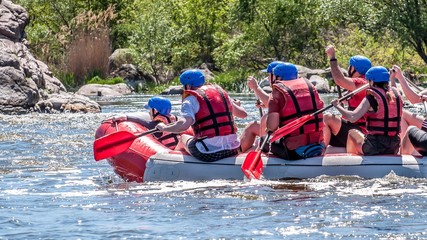 Rafting, kayaking. Extreme sport. Water ecological tourism. Close-up view of oars with splashing...