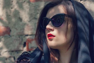 girl in glasses and a black kerchief