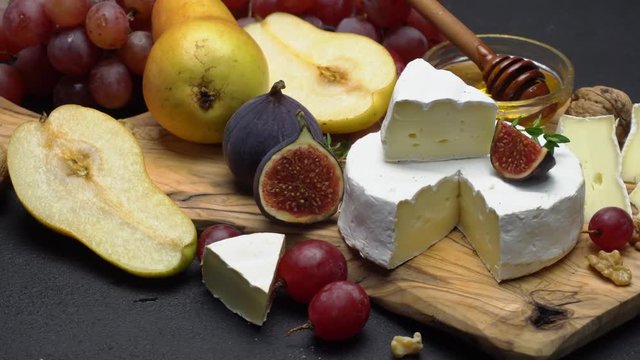 Video of brie or camembert cheese and grapes