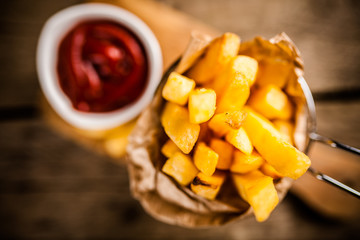 French fries on wooden table