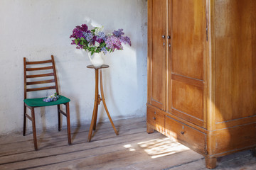 lilac in jug on old vintage interior