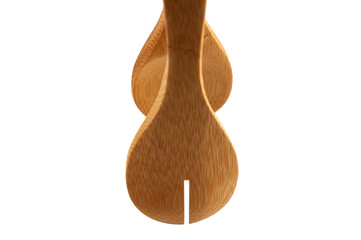 Kitchen forceps made of wood with a slot on a white background.