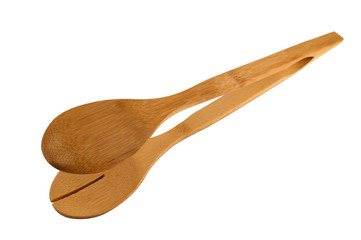 Kitchen tool cook - wooden tongs with a slot on a white background.