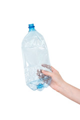 Female hand holding empty crushed blue plastic bottle isolated on white. Recyclable waste. Recycling, reuse, garbage disposal, resources, environment and ecology concept