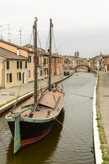 old barge moored in in san Pietro district, Comacchio, Italy