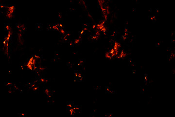 Smoldering coals on a black background