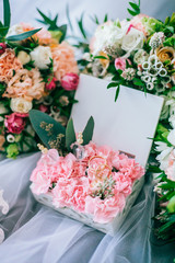 Wedding rings in a box with flowers. Accessories for wedding ceremony. 