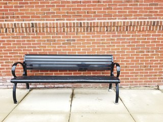 Empty bench at commuter train station
