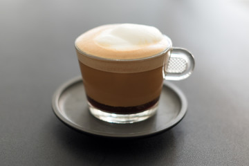 Cup of coffee. Cappuccino with foam selective focus