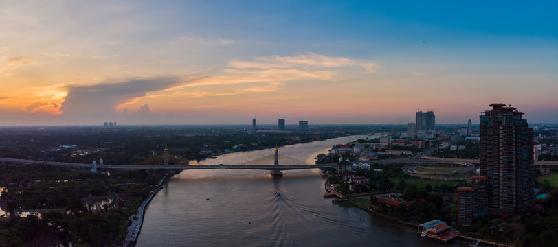 city and river in sunset