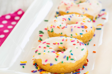 Donuts On White Tray With Sprinkles