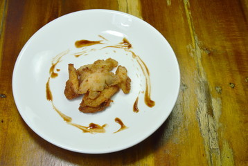 deep fried chicken dressing ketchup on white plate