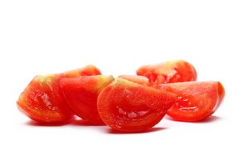 Fresh red tomato slices isolated on white background