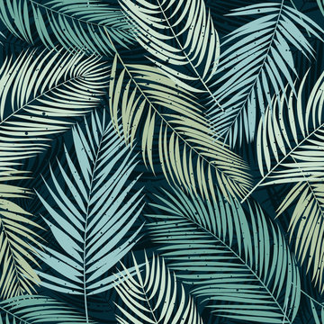 Seamless pattern with palm leaves. Tropical background. Vector illustration.