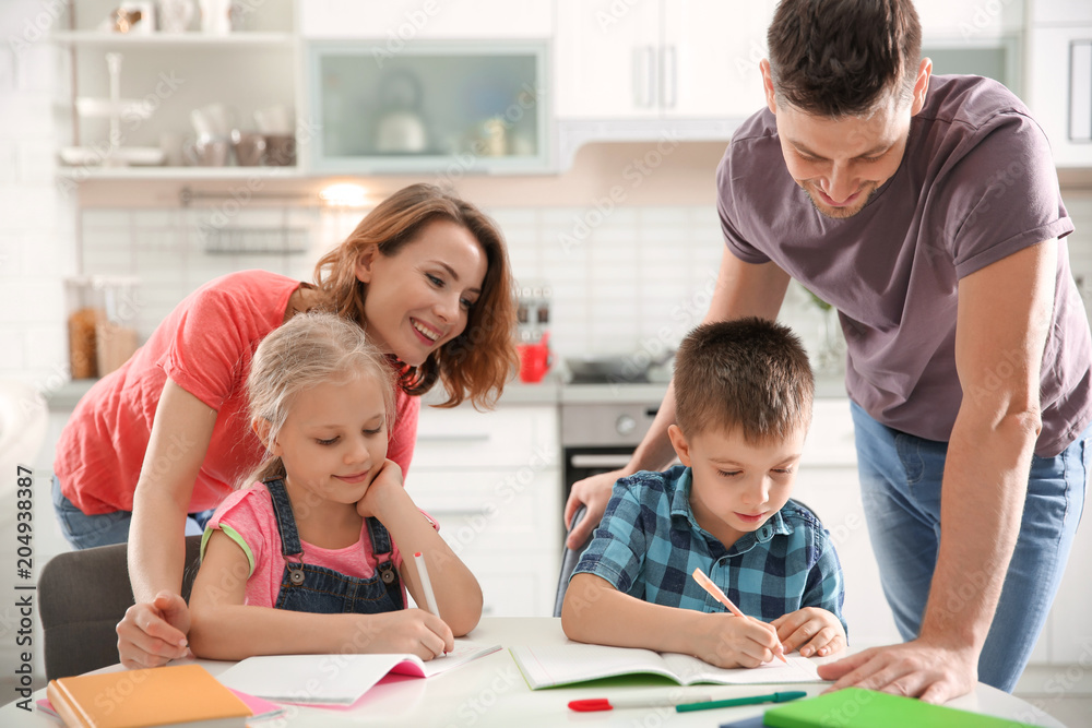 Poster Little children with parents doing homework at home