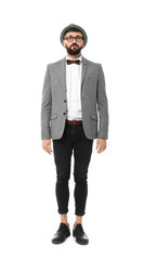 Portrait of handsome hipster in stylish outfit on white background
