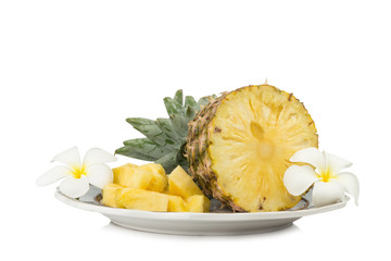 pineapple on dish half with flower isolated on white background