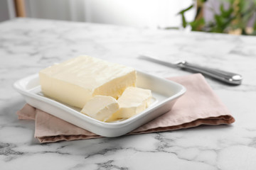 Fototapeta na wymiar Dish with tasty fresh butter on table