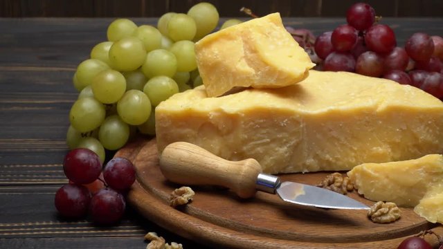 pieces of parmesan or parmigiano cheese and grapes