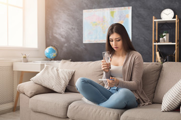 Sad girl reading the results of her pregnancy test