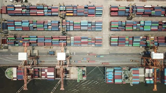 Container ship in export and import business and logistics in Thailand. Shipping cargo to harbor by crane. Water transport International. Aerial view
