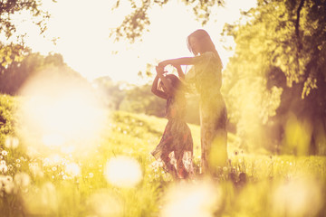 Mother and daughter at nature, spending time together.