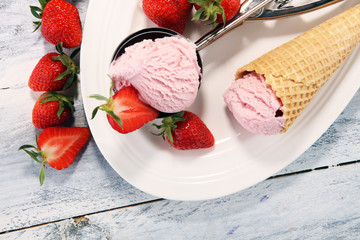 Delicious strawberry ice cream and waffle with fresh strawberries.
