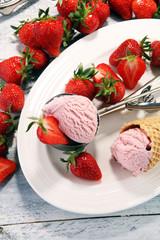 Delicious strawberry ice cream and waffle with fresh strawberries.