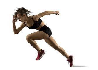 Woman sprinter leaving starting on the athletic track