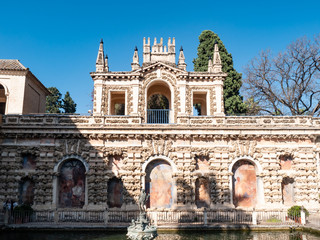 Palace of Alcazar, Famous Andalusian Architecture. Old Arab Palace in Seville, Spain. Ornamented Arch and Column. Famous travel destination.