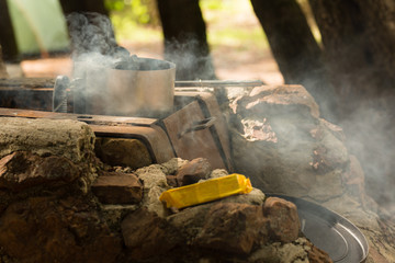 Charcoal being prepared for meal cooking during camping trip