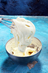 close up of a white whipped or sour cream in bowl.