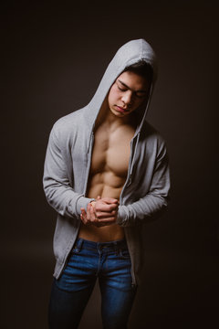 Fit Male Model Posing On Dark Background