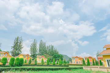 Orange home tuscany style in khaoyai resort at nakhonratchasima,vivid,sunny day,beautiful sky
