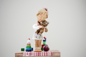 Wooden smiling blonde girl teddy bear toy dress