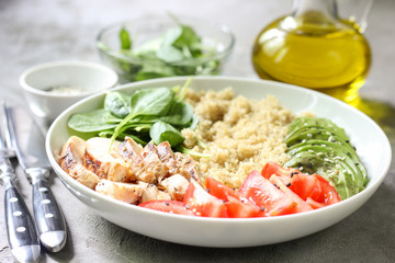 Healthy salad bowl with quinoa and chicken