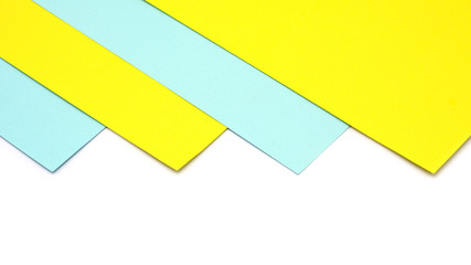 corner of a blue and yellow paper isolated on white background