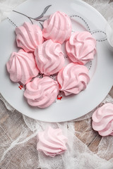 Pink meringue cookies.