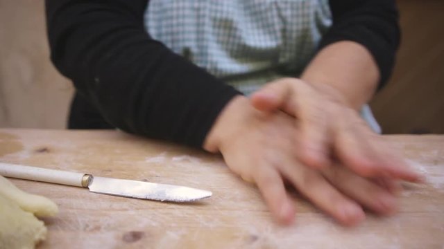Close up, chef rolls pasta dough