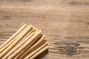 biscuit sticks on wood background