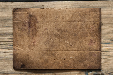 old paper on brown aged wood