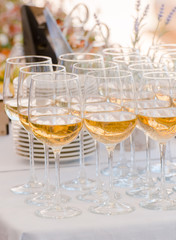 Champagne glasses being served on a party
